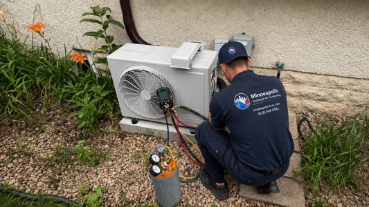 Rooftop HVAC units with Minneapolis skyline